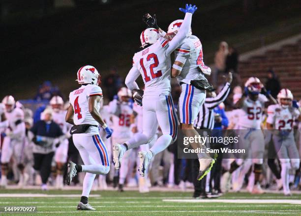 Linebacker Shanon Reid of the SMU Mustangs celebrates with cornerback linebacker Isaac Slade-Matautia of the SMU Mustangs after Reid recovered a...