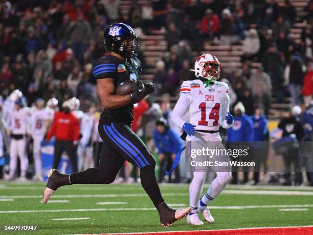 Running back Christopher Brooks of the Brigham Young Cougars runs for a touchdown against cornerback AJ Davis of the SMU Mustangs during the second...