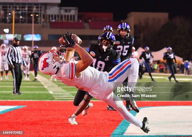 Wide receiver Jordan Kerley of the SMU Mustangs catches a touchdown pass against defensive back Kaleb Hayes of the Brigham Young Cougars during the...