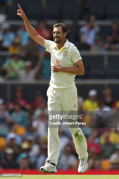 Mitchell Starc of Australia celebrates dismissing Keshav Maharaj of South Africa during day two of the First Test match between Australia and South...