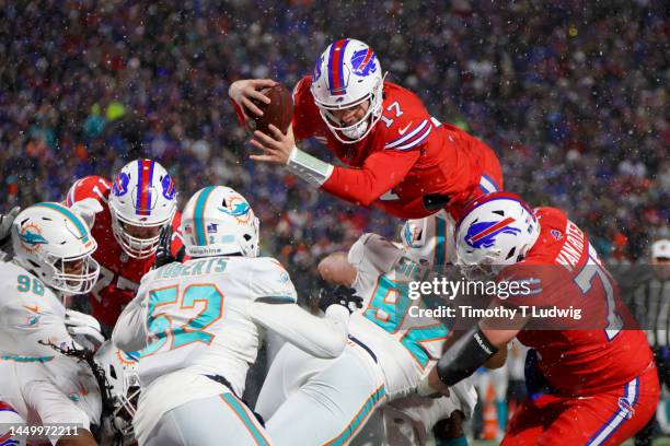 Josh Allen of the Buffalo Bills dives for a successful two point conversion against the Miami Dolphins during the fourth quarter of the game at...