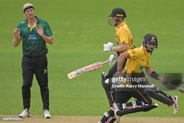Seth Rance of the Central Stags looks on as Troy Johnson and Luke Georgeson of the Wellington Firebirds run during the Ford Trophy match between the...