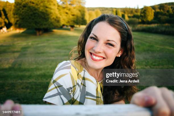 positive thinking woman smiling outdoors, happy woman adult with natural makeup look - pearl earring stock pictures, royalty-free photos & images