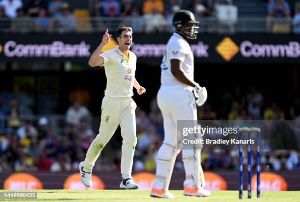 Pat Cummins of Australia celebrates taking the wicket of Lungi Ngidi of South Africa during day two of the First Test match between Australia and...