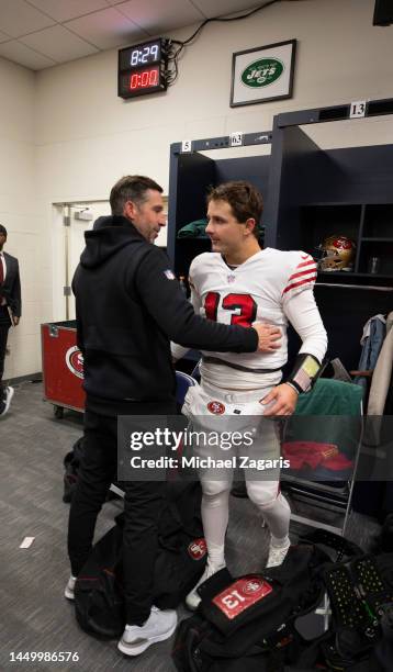 Head Coach Kyle Shanahan and Brock Purdy of the San Francisco 49ers in the locker room after the game against the Seattle Seahawks at Lumen Field on...