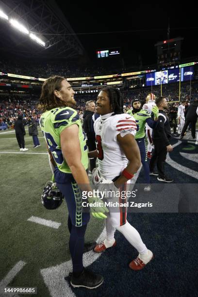 Ray-Ray McCloud III of the San Francisco 49ers and Tanner Muse of the Seattle Seahawks on the field after the game at Lumen Field on December 15,...