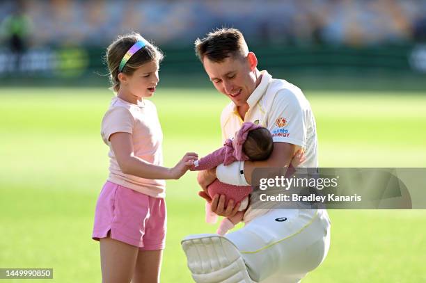 Marnus Labuschagne of Australia is seen holding is little baby girl Hallie Grace Labuschagne after day two of the First Test match between Australia...