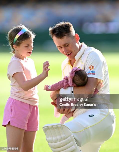 Marnus Labuschagne of Australia is seen holding is little baby girl Hallie Grace Labuschagne after day two of the First Test match between Australia...