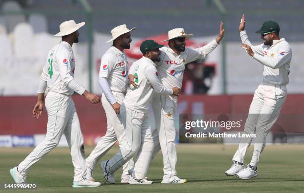 Azhar Ali of Pakistan is congratulated on running out Ben Stokes of England during Day Two of the Third Test between Pakistan and England at Karachi...