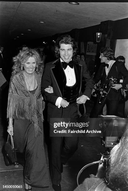 Diana Hyland and John Travolta attend an event at the Santa Monica Civic Auditorium in Santa Monica, California, on November 20, 1976.