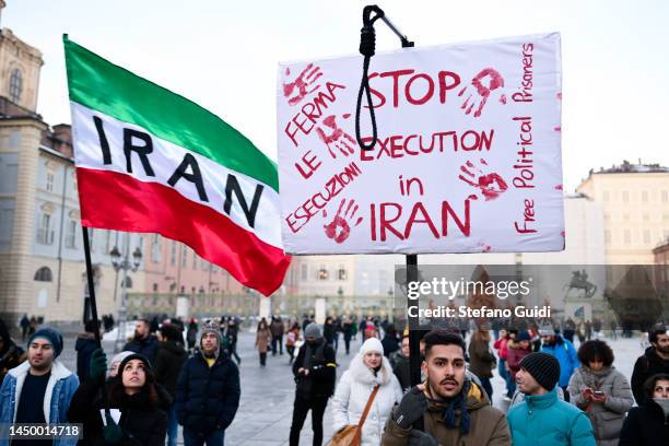 General view of people holds a protest sign during the protest in honor of the lives of Iranian Women on December 17, 2022 in Turin, Italy. In the...