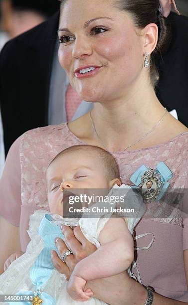 Crown Princess Victoria of Sweden holds her daughter Princess Estelle Silvia Ewa Mary of Sweden during her christening at The Royal Palace on May 22,...