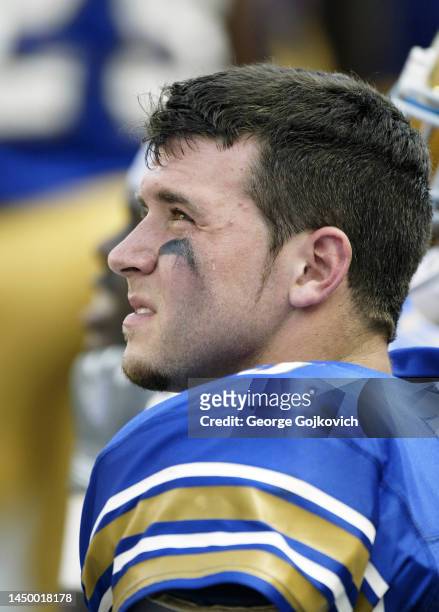 Quarterback Tyler Palko of the University of Pittsburgh Panthers looks on from the sideline during a college football game against the Youngstown...