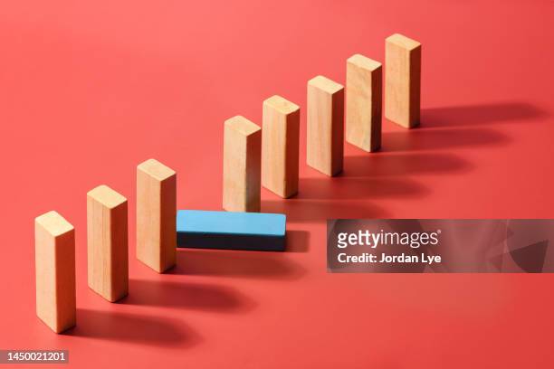 domino concept idea of business risk, strategy and planning - mislukking stockfoto's en -beelden