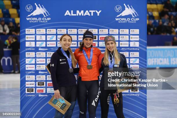 Kristen Santos-Griswold of USA, Suzanne Schulting of Netherlands and Anna Seidel of Germany pose after medal ceremony of Women’s 1000m Final A race...