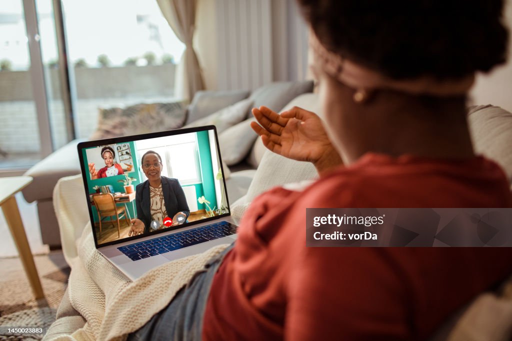 Young woman talking to her therapist online