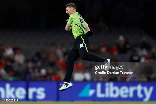 Daniel Sams of the Thunder celebrates the wicket of Andre Russell of the Renegades during the Men's Big Bash League match between the Melbourne...