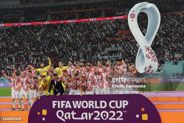 The Croatia team celebrates after the 3rd place medal ceremony following the final whistle of the FIFA World Cup Qatar 2022 3rd Place match between...
