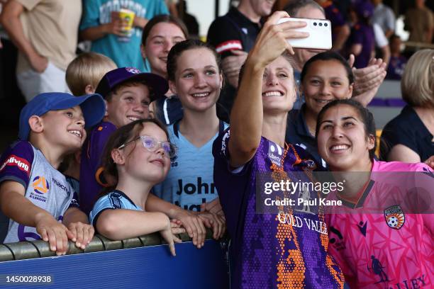 Natasha Rigby and Morgan Aquino of the Glory pose for selfies with supporters after winning the round five A-League Women's match between Perth Glory...