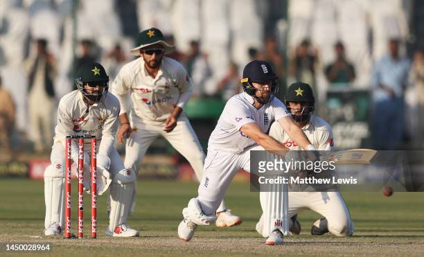 Jack Leach of England sweeps the ball during Day Two of the Third Test between Pakistan and England at Karachi National Stadium on December 18, 2022...