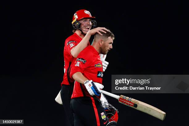 Will Sutherland of the Renegades rubs the head of team mate and match winner Aaron Finch during the Men's Big Bash League match between the Melbourne...