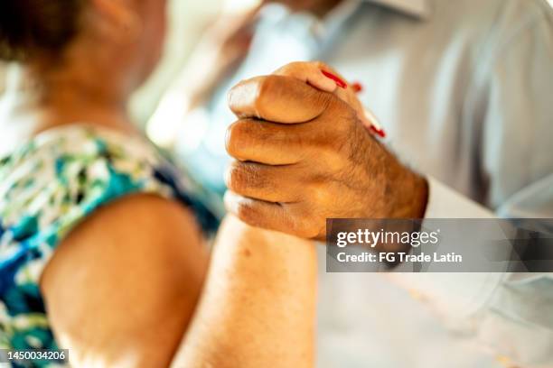 close-up of senior couple dancing at a dance studio - older couple ballroom dancing stock pictures, royalty-free photos & images
