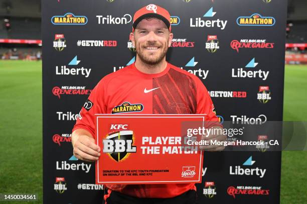 Aaron Finch of the Renegades poses with the player of the match certificate following the Men's Big Bash League match between the Melbourne Renegades...