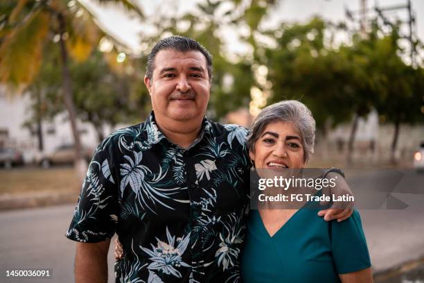 portrait of senior couple outdoors - hispanic couple stock pictures, royalty-free photos & images