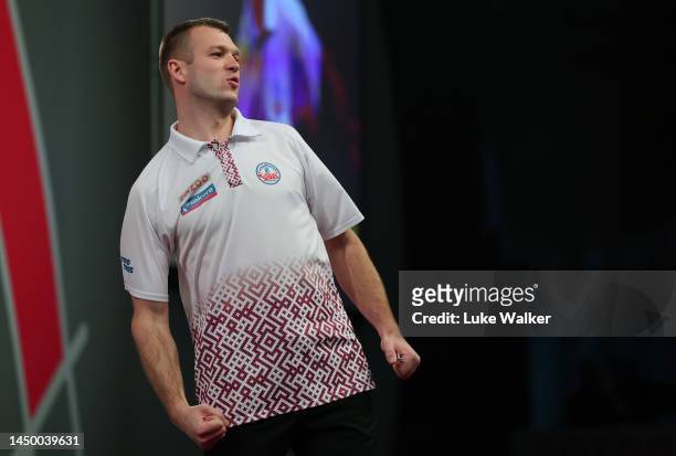 Madars Razma of Latvia reacts during his First Round Match against Prakash Jiwa of India during Day Four of The Cazoo World Darts Championship at...