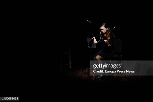 The violinist, Maria Teresa Gamaza Acuña, performs at the meeting 'Stories of a war' organized by the newspaper El Pais, in Caixaforum space, on 18...