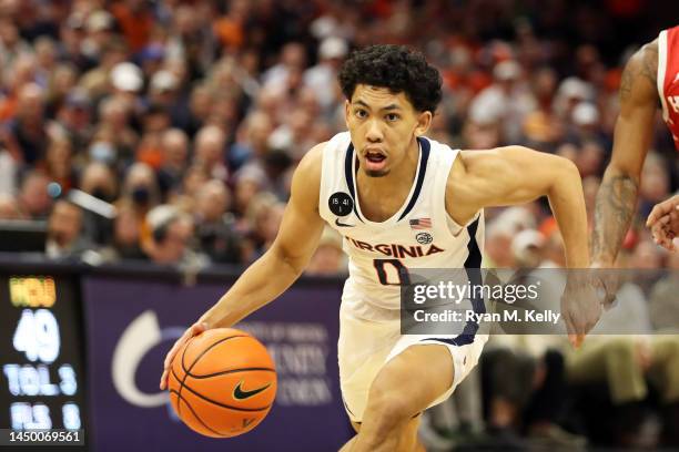 Kihei Clark of the Virginia Cavaliers dribbles in the second half during a game against the Houston Cougars at John Paul Jones Arena on December 17,...