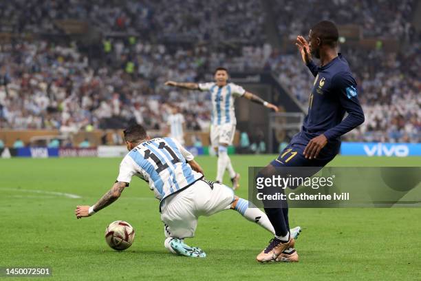 Angel Di Maria of Argentina is fouled by Ousmane Dembele of France which leads to a penalty to Argentina during the FIFA World Cup Qatar 2022 Final...