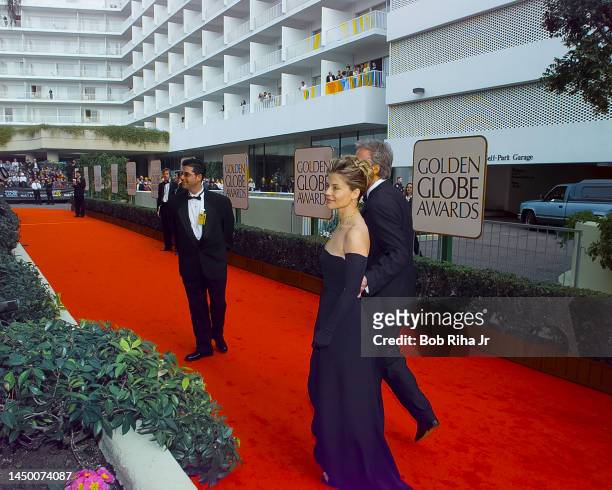 James Cameron and Linda Hamilton walk the red carpet as they arrive at Beverly Hilton Hotel for the 55th Annual Golden Globes Awards Show, January...