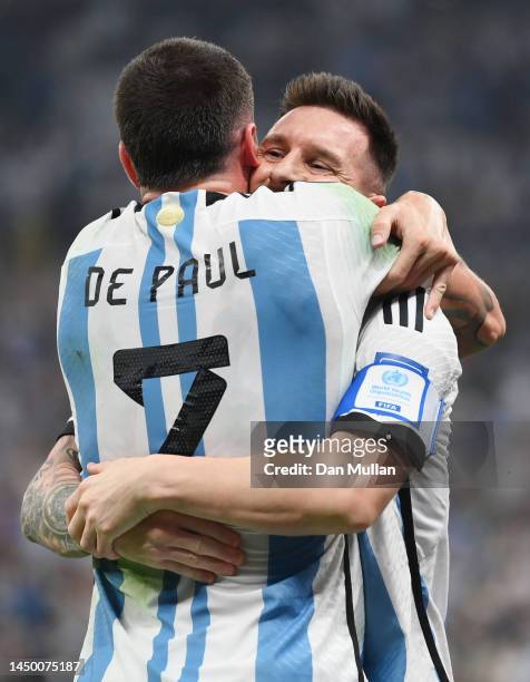 Lionel Messi of Argentina celebrates with Rodrigo De Paul after scoring the team's first goal via a penalty during the FIFA World Cup Qatar 2022...