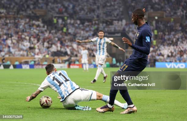 Angel Di Maria of Argentina is fouled by Ousmane Dembele of France which leads to a penalty to Argentina during the FIFA World Cup Qatar 2022 Final...