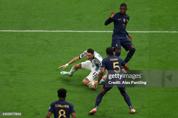 Angel Di Maria of Argentina is fouled by Ousmane Dembele of France which leads to a penalty to Argentina during the FIFA World Cup Qatar 2022 Final...