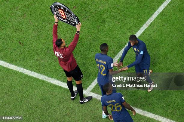 Ousmane Dembele is replaced by Randal Kolo Muani of France in the first half during the FIFA World Cup Qatar 2022 Final match between Argentina and...