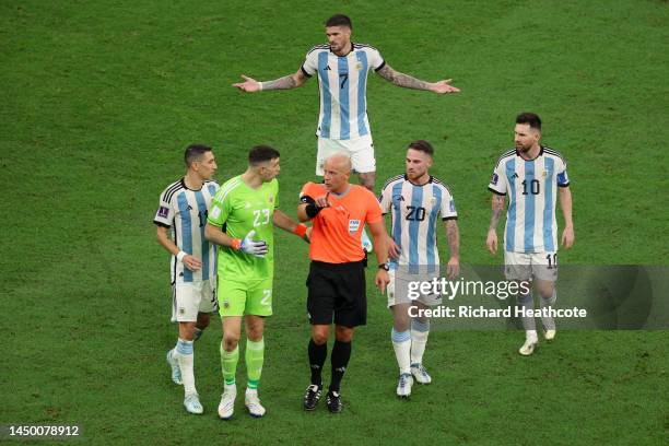 Argentina players speak to Referee Szymon Marciniak during the FIFA World Cup Qatar 2022 Final match between Argentina and France at Lusail Stadium...