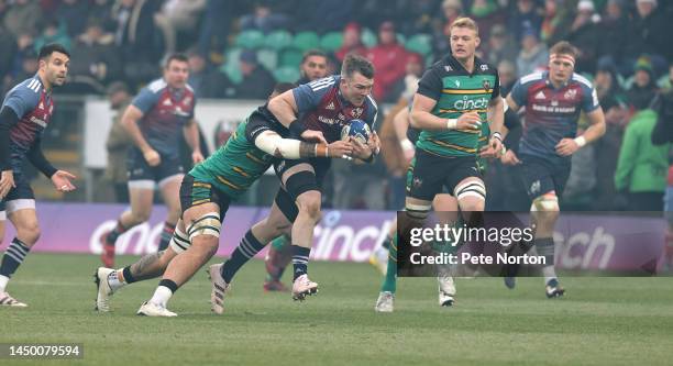 Peter O'Mahony of Munster Rugby moves forward with the ball during the Heineken Champions Cup match between Northampton Saints and Munster Rugby at...