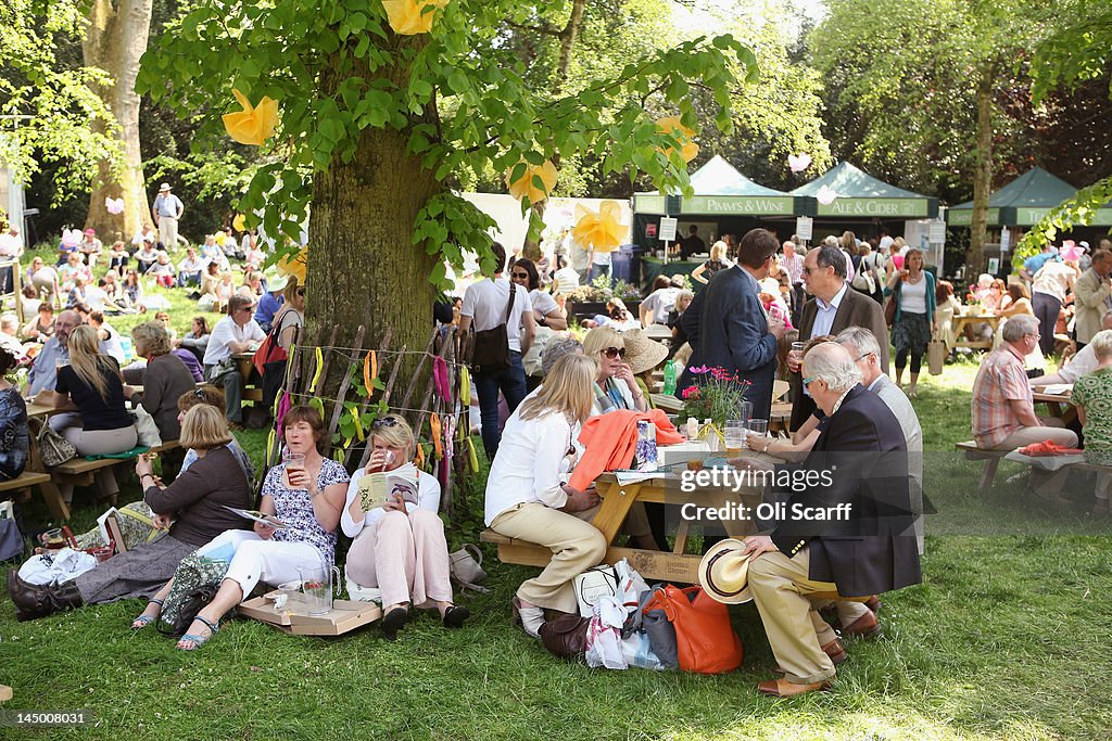 Visitors To The Chelsea Flower Show Enjoy The Warm Weather