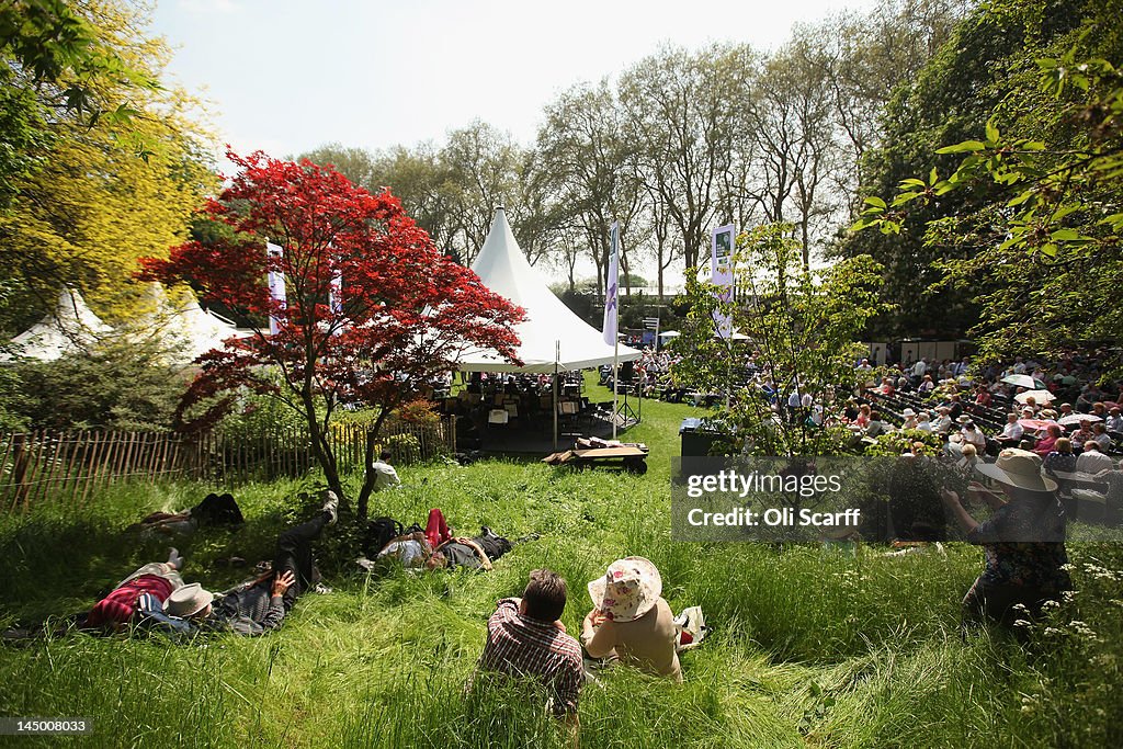 Visitors To The Chelsea Flower Show Enjoy The Warm Weather