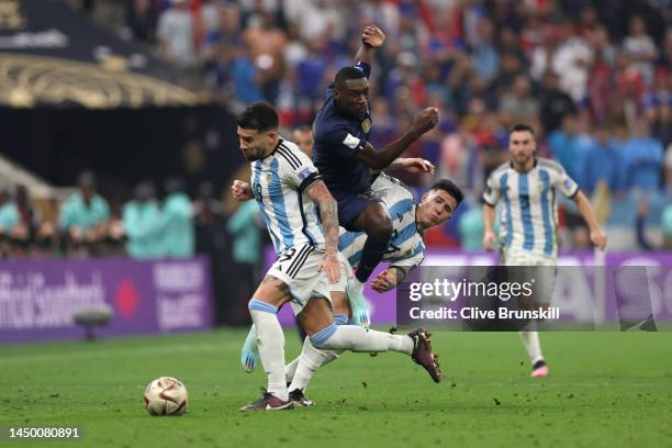 Randal Kolo Muani of France is challenged by Nicolas Otamendi and Enzo Fernandez of Argentina during the FIFA World Cup Qatar 2022 Final match...