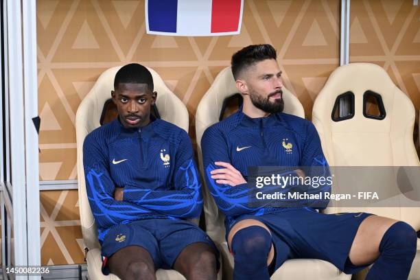 Ousmane Dembele and Olivier Giroud of France are seen on the bench during the FIFA World Cup Qatar 2022 Final match between Argentina and France at...