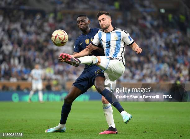 Randal Kolo Muani of France battles for possession with Nicolas Tagliafico of Argentina during the FIFA World Cup Qatar 2022 Final match between...