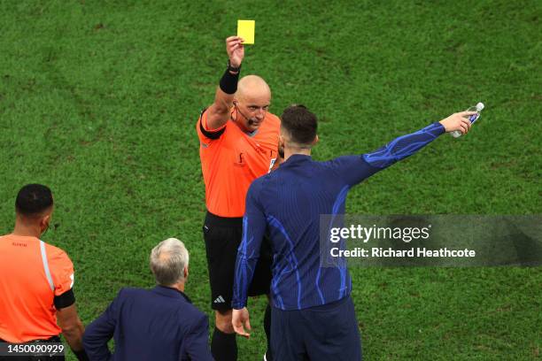 Olivier Giroud of France is shown a yellow card by referee Szymon Marciniak during the FIFA World Cup Qatar 2022 Final match between Argentina and...