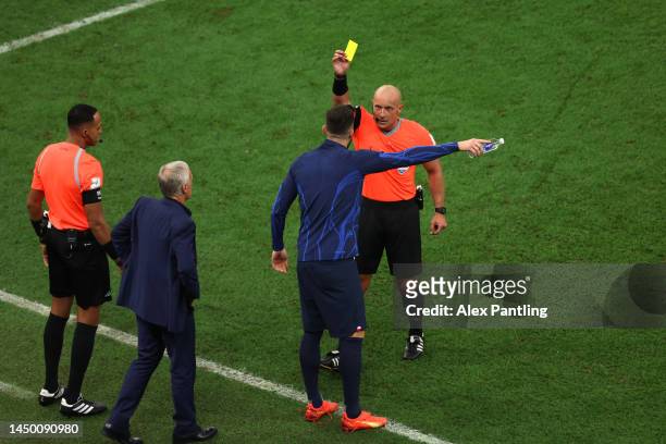 Olivier Giroud of France is shown a yellow card by referee Szymon Marciniak during the FIFA World Cup Qatar 2022 Final match between Argentina and...