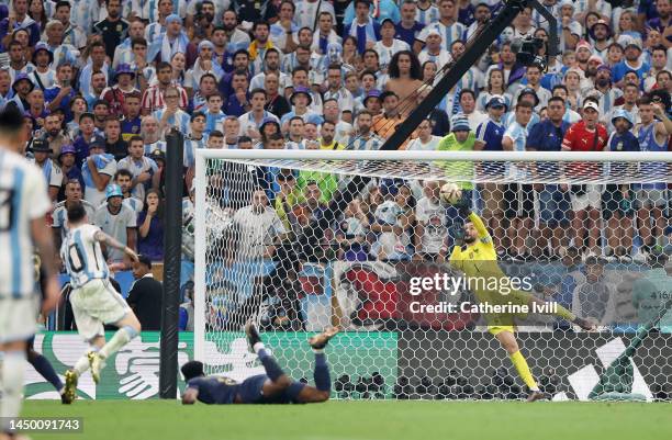 Hugo Lloris of France makes a save against Lionel Messi of Argentina during the FIFA World Cup Qatar 2022 Final match between Argentina and France at...