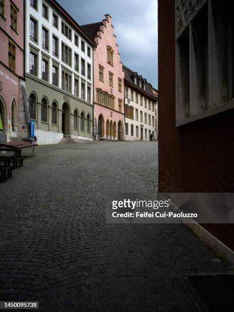 narrow at old town street - schweiz stadt stock-fotos und bilder