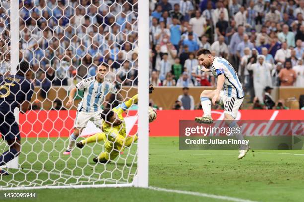 Lionel Messi of Argentina scores the team's third goal past Hugo Lloris of France during the FIFA World Cup Qatar 2022 Final match between Argentina...