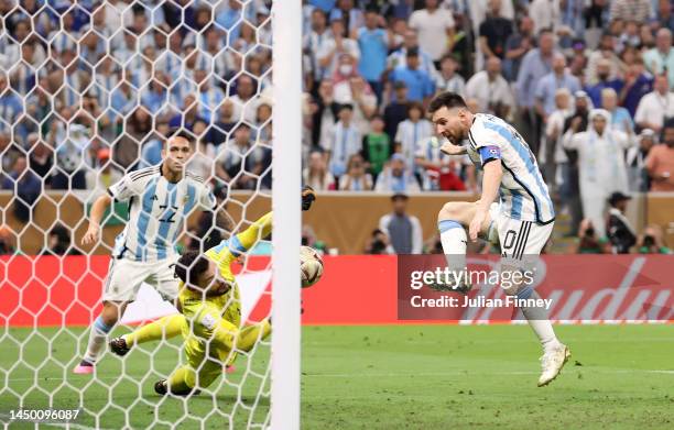 Lionel Messi of Argentina scores the team's third goal past Hugo Lloris of France during the FIFA World Cup Qatar 2022 Final match between Argentina...